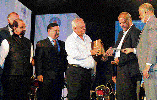 nostalgic moment: KSCA Secretary Brijesh Patel (right) and BCCI interim president Shivlal Yadav (second from right) honour the captain of the first Karnataka team to win the Ranji Trophy, EAS Prasanna, at a function in Bangalore on Saturday.  G R Viswanath (left) and B&#8200;Siddharamu, Prasanna's team-mates then, look on. DH PHOTO