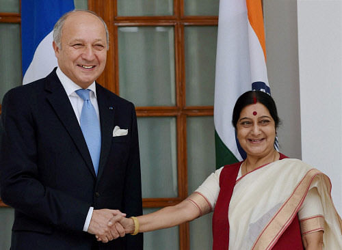 External Affairs Minister Sushma Swaraj shake hands with Foreign Minister Laurent Fabius of France before a meeting in New Delhi on Monday. PTI Photo