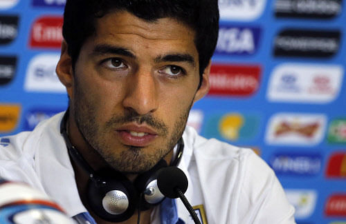 Luis Suarez has issued an apology to Italy defender Giorgio Chiellini for biting him during a World Cup match and vowed never to do it again. Reuters photo