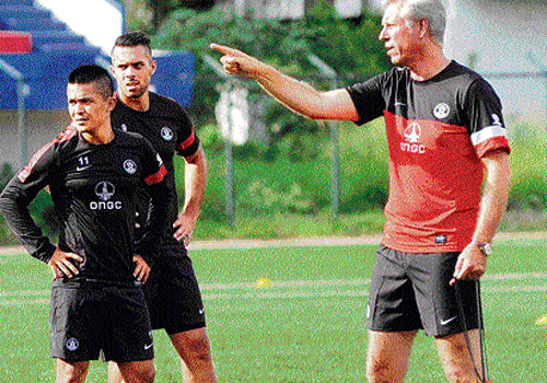 listening to the boss: Wim Koevermans (right) instructs two of his senior wards, Robin Singh (centre) and Sunil Chhetri at the Bangalore Football Stadium on Wednesday, as the Indian side began its preparatory camp for the Asian Games. DH Sports