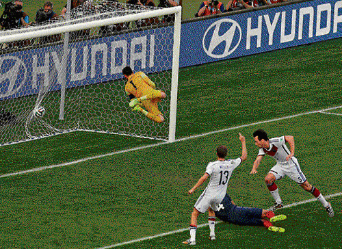 into the net: Germany's Mats Hummels (right, jersey number 5) scores a goal against France in their quarterfinal match at the Maracana on Friday. Reuters