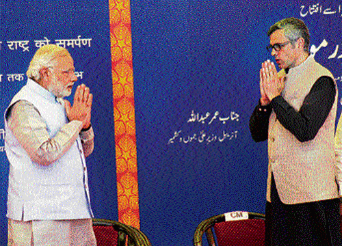 Prime Minister Narendra Modi with Jammu & Kashmir Chief Minister Omar Abdullah during the inauguration of  Katra-Udhampur rail link in Katra on Friday. PTI
