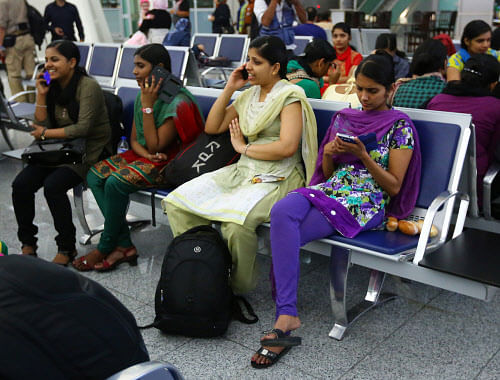 Indian nurses who were trapped in territory captured by Islamic militants wait for the plane to begin their journey home at Irbil International Airport, Iraq, on Friday, July 4, 2014. More than 40 Indian nurses who were trapped in territory captured by Islamic militants crossed into Iraq's largely autonomous Kurdish region Friday and will be under the protection of local security forces until flying home later in the day, authorities said. AP photo