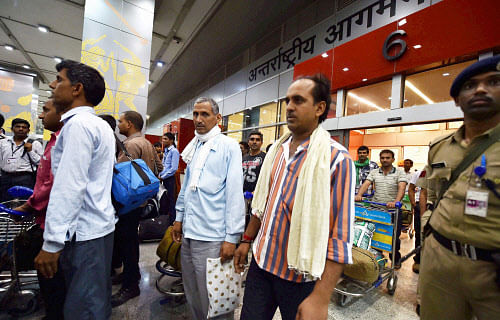 Indians who were stranded in Iraq on their arrival at IGI Airport T3 in New Delhi on Saturday. PTI Photo
