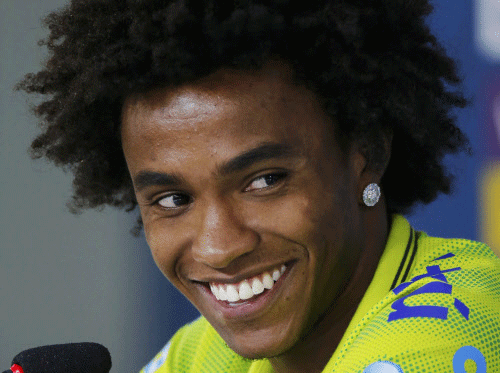 Coach Luiz Felipe Scolari hinted in training that midfielder Willian is his first option to replace Neymar in Brazil's World Cup semifinal against Germany. Reuters photo