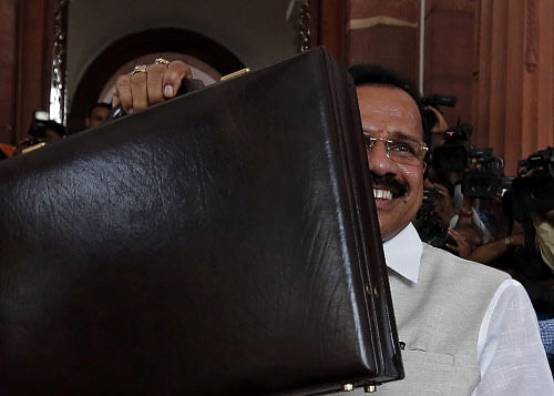 Railway Minister Sadananda Gowda arrives to present the railway budget for the 2014/15 fiscal year, at the parliament in New Delhi July 8, 2014. Reuters