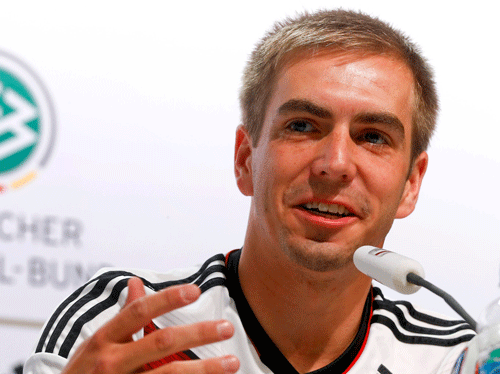 Germany's national soccer team player Philipp Lahm gestures as he addresses a news conference in the village of Santo Andre north of Porto Seguro July 11, 2014. REUTERS