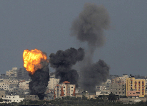 n explosion is seen in the northern Gaza Strip after an Israeli air strike July 13, 2014.  Reuters photo