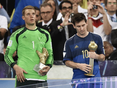 Germany's goalkeeper Manuel Neuer, left, winner of the Golden Glove award for best goalkeeper, stands with Argentina's Lionel Messi, right, winner of the Golden Ball award as the tournament's top player, after the World Cup final soccer match between Germany and Argentina at the Maracana Stadium in Rio de Janeiro, Brazil. AP photo