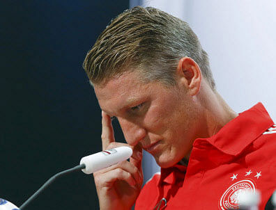 Bloodied and bruised, Bastian Schweinsteiger paid tribute to Germany's fans after a historic victory saw the country become the first Europeans to win the World Cup in the Americas. Reuters photo