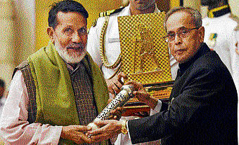 President Pranab Mukherjee presents Gandhi  Peace Prize 2013 to Chandi Prasad Bhatt  in New Delhi on Tuesday. PTI