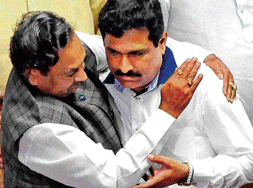 Leader of Opposition K S Eshwarappa hugs JD(S) leader  Puttanna after the latter was officially declared the deputy chairman of the Legislative Council on Tuesday. dh Photo