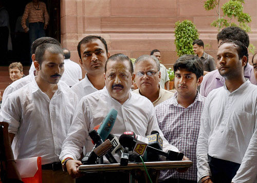 Minister of State in the Prime Minister's Office Jitendra Singh, flanked by aspirants of Civil Services, talks to the media at Parliament in New Delhi on Tuesday. PTI Photo