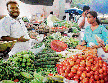 out of reach: Shortage of rainfall and less supply have considerably pushed up the prices of vegetables. dh Photo