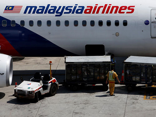 Malaysia Airlines today said it would offer full refunds to passengers intending to cancel tickets and waive fees for customers who want to change their travel plans following the downing of MH17 over Ukraine, months after the mysterious crash of MH370. Reuters photo