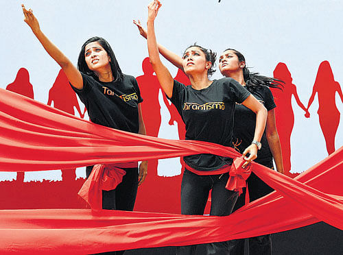 Protesters perform at a rally at the Freedom Park against the alleged rape of a six-year-old girl in  Bangalore on Sunday. (Below) The accused, Mustafa, is produced before the media. DH photo