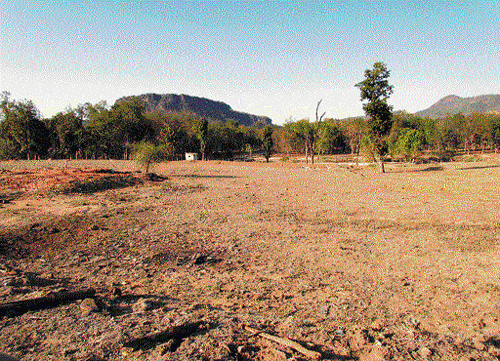 displacement Satpura relocation site; (below) A house in Satpura village.