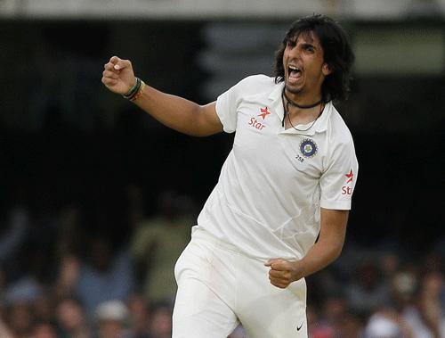 Ishant Sharma celebrates the wicket of England's Ian Bell during the fourth day of the second test match between England and India at Lord's cricket ground in London, Sunday, July 20, 2014. (AP Photo)