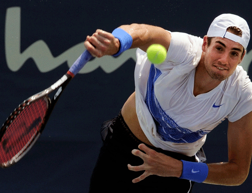 Top seed American John Isner saved two match points before edging compatriot Robby Ginepri 4-6, 7-6 (7-5), 7-5 in the second round of the Atlanta Open on Thursday. AP file photo