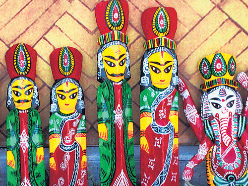 Brightly-coloured wooden dolls on display. Photo by Dilip Banerjee