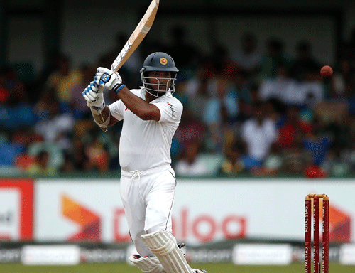 Sri Lanka s Kumar Sangakkara plays a shot during the fourth day of their second test cricket match against South Africa in Colombo July 27, 2014. REUTERS photo