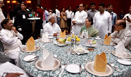 Congress President Sonia Gandhi with RJD chief Lalu Yadav, JD(U) chief Sharad Yadav and NCP leader Tariq Anwar (R) during her Iftar party in New Delhi on Sunday. PTI Photo