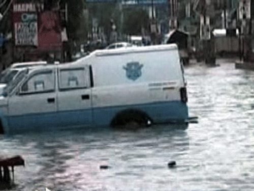 Vehicles stuck amid flood water. Five people were killed in a landslide in Uttarakhand and the meteorological department Monday warned of another round of incessant downpour within 48 hours. PTI photo