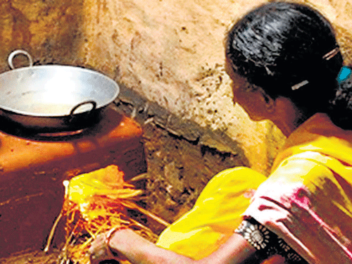 what's cooking A woman in Bandipur village using an eco-chulha. Photo by author.