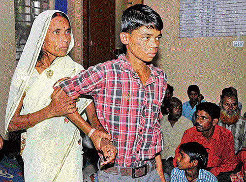 Bimala is reunited with her son Dilip in the City on Monday. dh photo
