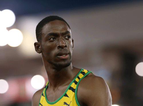 Kemar Bailey Cole of Jamaica looks back after winning the men100 meter race at Hampden Park stadium during the Commonwealth Games 2014 in Glasgow, Scotland, Monday July 28, 2014. AP Photo