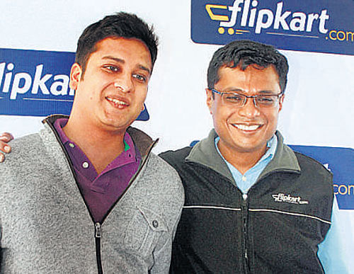 Flipkart CEO Sachin Bansal (right) with co-founder Binny Bansal in Bangalore on Tuesday. DH Photo Srikanta Sharma R