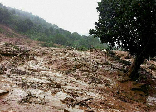 At least 18 people were killed when landslides triggered by relentless rain struck Malingaon, some 120 km from Pune, early on Wednesday, burying over 160 people. PTI  photo