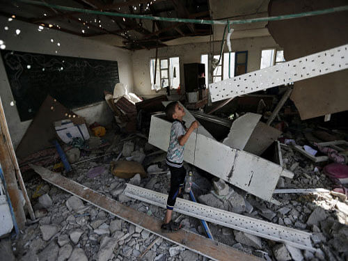 At least 92 Palestinians were killed today, including 20 at a UN-run school, in fierce fighting between Israel and Hamas in Gaza and the death toll sharply rose to 1,323 despite the Jewish nation agreeing to observe a four-hour humanitarian pause. AP photo