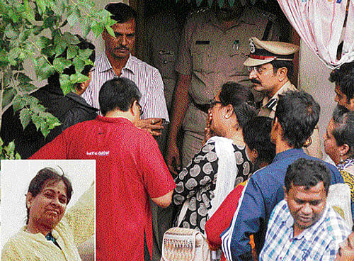 Relatives gather at the house of Prathima S R (inset), where she was found murdered on Thursday. dh photo
