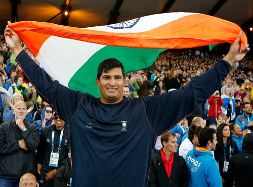 Vikas Shive Gowda of India celebrates after winning the men's discus final at Hampden Park Stadium during the Commonwealth Games 2014 in Glasgow, Scotland.  AP Photo