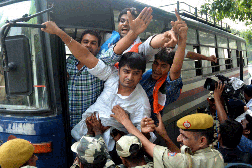 Police detaining NSUI members during a protest against CSAT format in front of residence of Union Home Minister Rajnath Singh in New Delhi on Saturday. PTI Photo