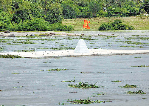 Deluge: The Purandara Mantapa is submerged in rainwater at Hampi in Hospet. dh Photo
