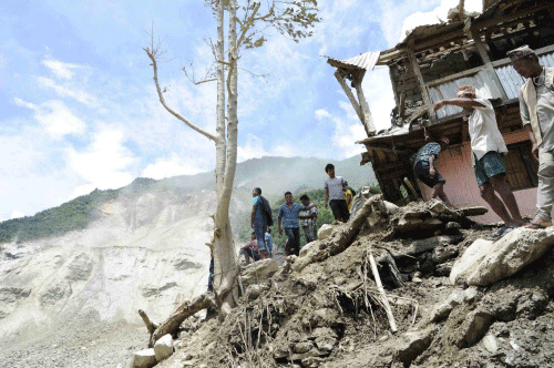 People are seen at the landslide area in Sindhupalchowk district in this handout picture. Reuters photo
