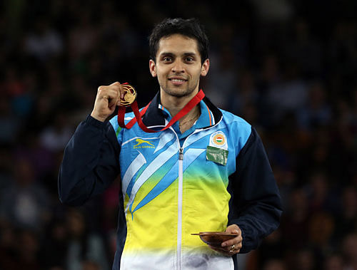 India's Kashyap Parupalli poses with his gold medal after his victory over Singapore's Derek Wong at the end of their men's single's Badminton match at the Emirates Arena during the Commonwealth Games Glasgow 2014, in Glasgow, Scotland, Sunday, Aug. 3, 2014. (AP Photo)