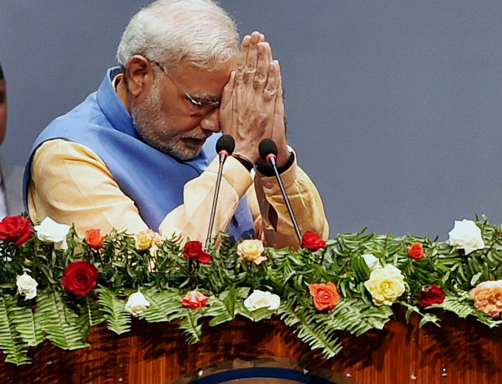 Prime Minister Narendra Modi today pledged to end Nepal's crippling blackouts and offered to buy electricity from the country, scotching reports that India was attempting to monopolise water resources of this Himalayan nation. PTI photo