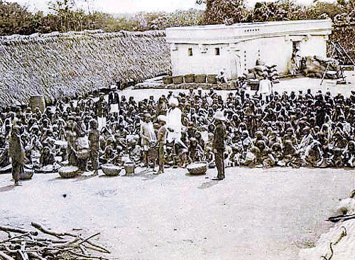 Famine victimswaiting outside the Binnamangala Relief Kitchen.