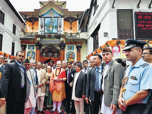 Prime Minister Narendra Modi offers prayers at the Pashupatinath temple in Kathmandu on Monday. PTI