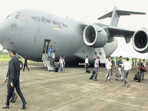 Medical personnel arrive at the Air Force Station, Purnea, to take part in flood relief  operations in Bihar on Monday. PTI