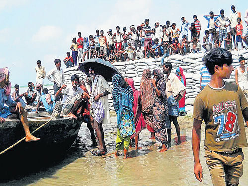 Flood-affected villagers wait to be rescued in the Saharsa district of Bihar after the heavy inflow of water into the Kosi river from the Nepal side. PTI