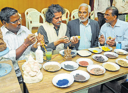 Close to nature: Karnataka State Pollution Control Board chairman Vaman Acharya  (second from right)&#8200;looks at the  eco-friendly Ganesha idols being created at a workshop organised in the City on Tuesday. dh Photo