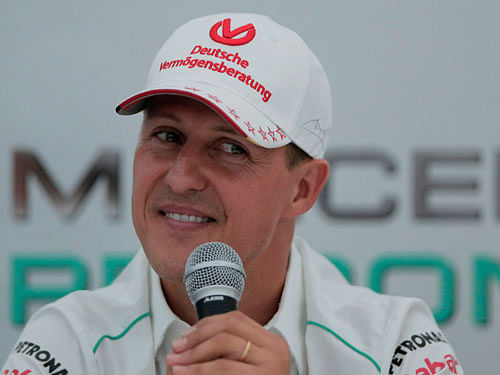 Swiss prosecutors say a man arrested in connection with the suspected theft of former Formula One champion Michael Schumacher's medical records has been found hanged in his cell. AP file photo
