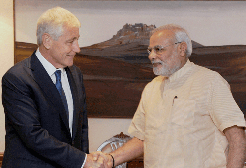 Prime Minister Narendra Modi shakes hands with US Defence Secretary Chuck Hagel during a meeting in New Delhi on Friday. PTI Photo