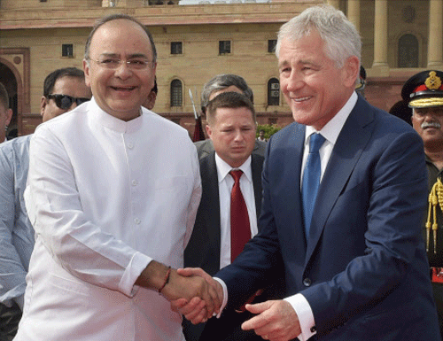 Defence Minister Arun Jaitley shakes hands with US Defence Secretary Chuck Hagel before he was presented a guard of honour at South Block in New Delhi on Friday. PTI Photo