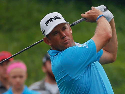Lee Westwood stormed into a share of the PGA Championship lead with five birdies in his last six holes on Thursday as fourtimes winner Tiger Woods ended the opening round a distant nine shots off the pace.