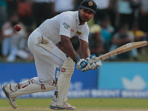 Sri Lankan batsman Kumar Sangakkara plays a shot during the third day of the first test cricket match between Sri Lanka and Pakistan in Galle, Sri Lanka, Friday, Aug. 8, 2014.